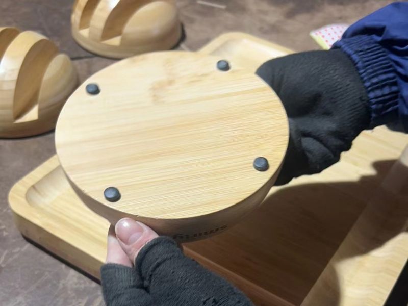 QC inspector checking bamboo cutting board surface