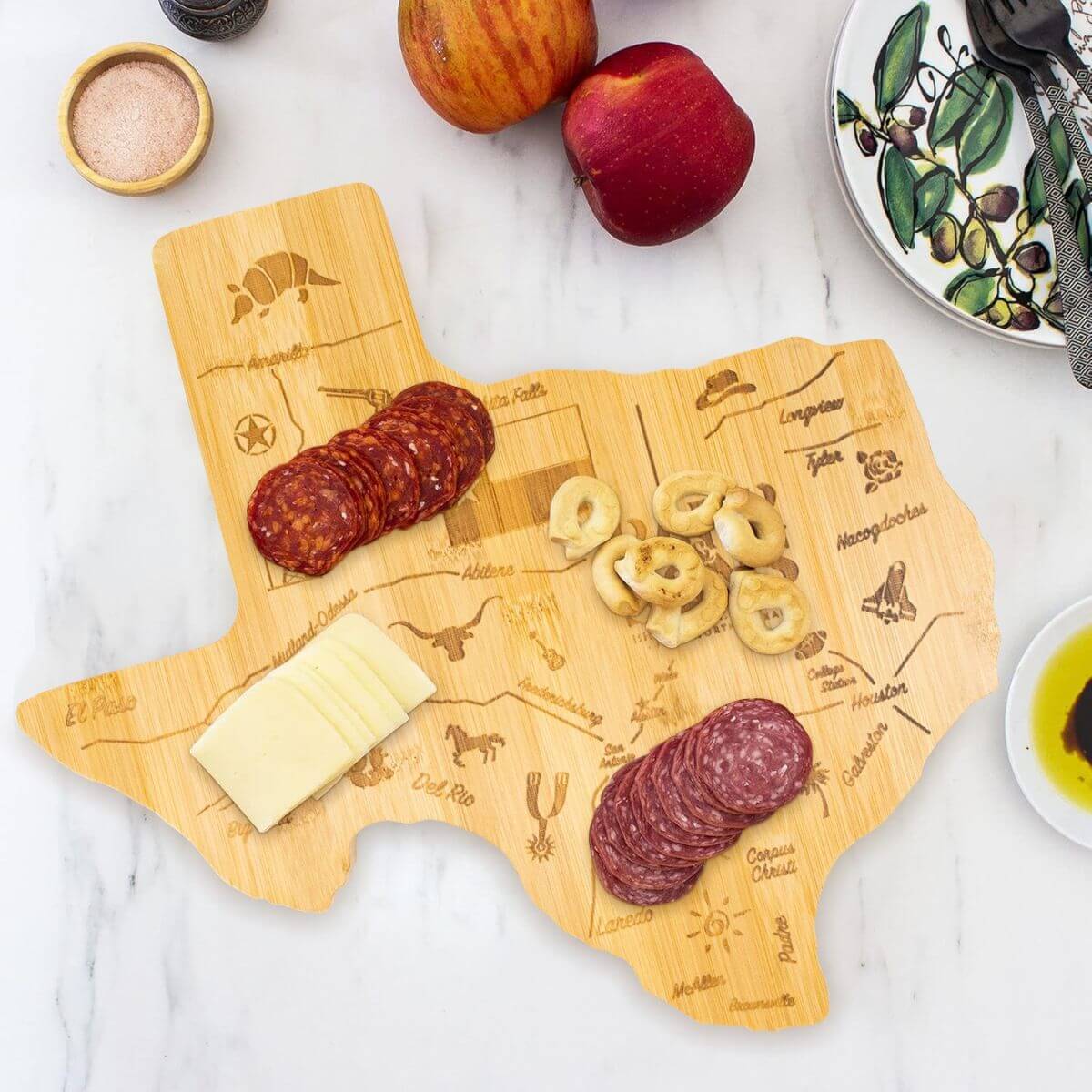 Custom map shape bamboo cutting board used as a charcuterie serving board.