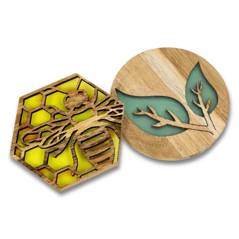 Acacia wood coasters with colored resin inlay: hexagon bee in amber yellow and round leaf in emerald green, on white background.