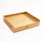 Bamboo coffee pod storage drawer with removable 35-pod grid, front view on white background.