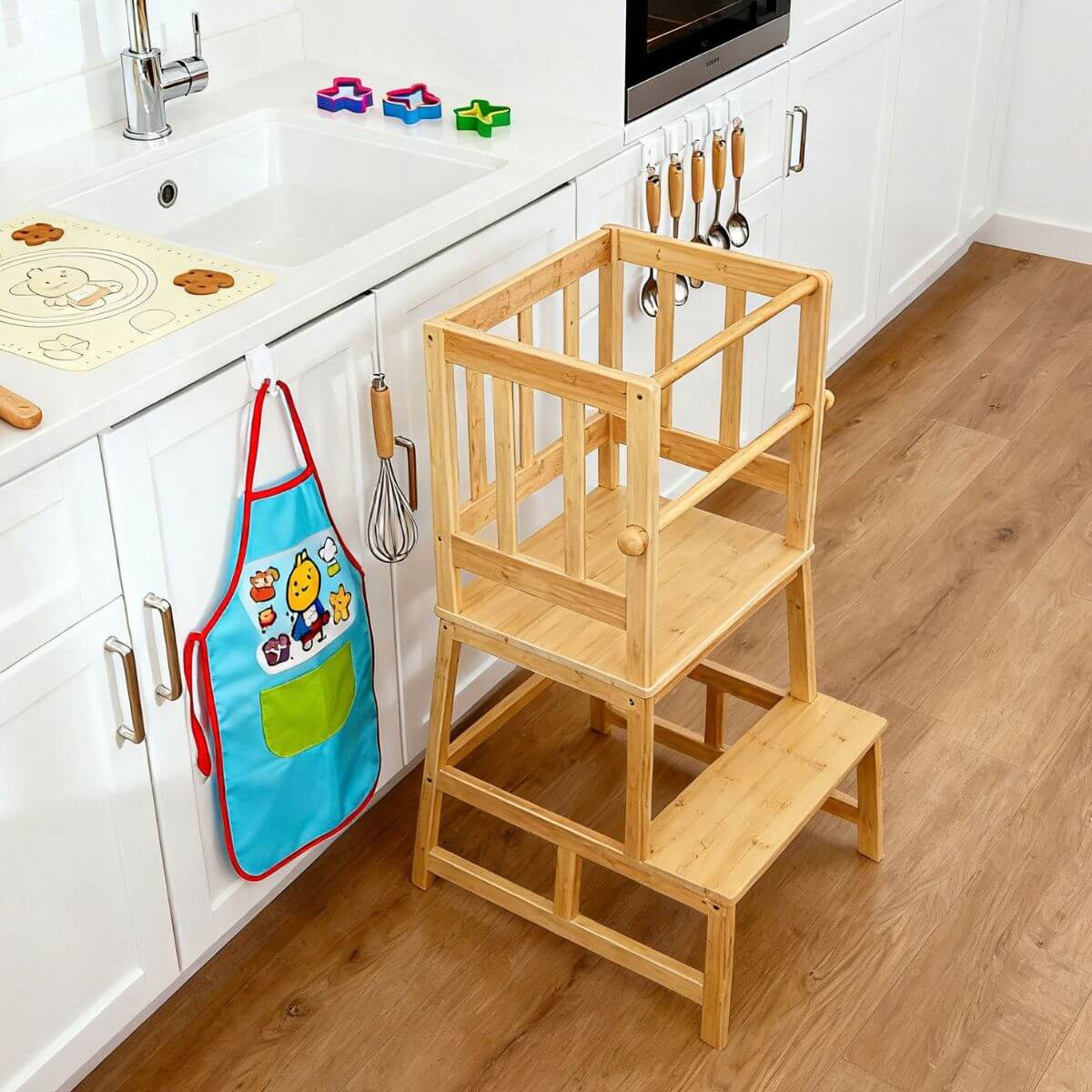 Bamboo toddler learning tower with full surround safety rail and two-step design.