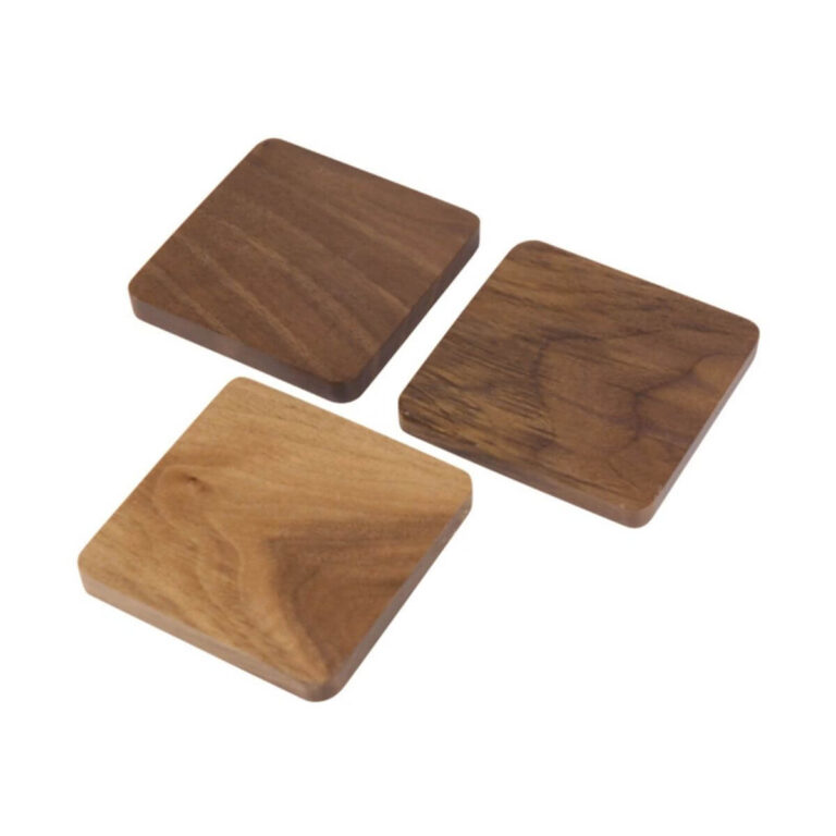 Multi-wood stackable coaster set of 3 in black walnut, acacia and cherry wood, angled view on white background.