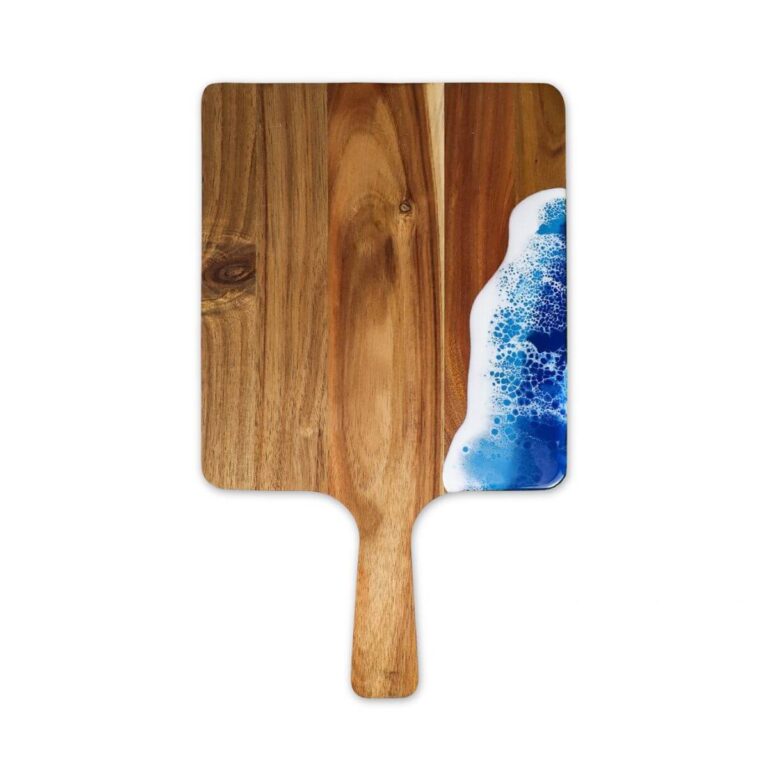 Rectangular acacia wood and blue epoxy resin serving board with handle pointing down, front view on white background.